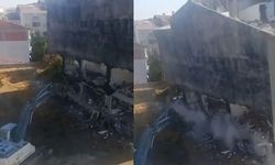 Ağır hasarlı bina kepçenin üstüne çöktü