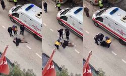 Yolun ortasında yatan kadın, sinir krizi geçirdi